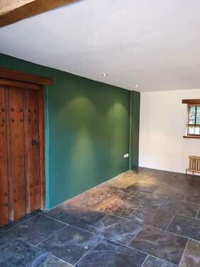 Picture of a hallway painted dark green by Painters and Decorators Rotherham