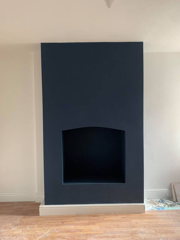 A picture of a feature wall painted in white matte and turquoise matte paint by Painters and Decorators Rotherham 