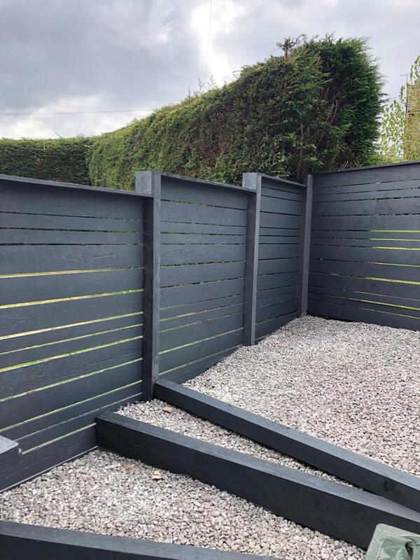 A picture of garden fence panels painted grey by Painter and Decorators Rotherham.